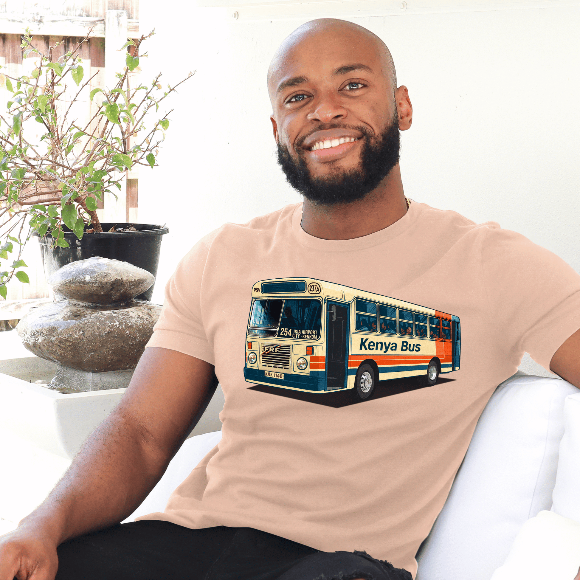 Man wearing a  t-shirt with a Kenya bus made by marto and t-shirts